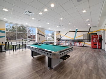 Games room with pool table and seating